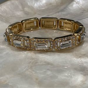 Beautiful gold colored rhinestone stretchy bracelet. Unsigned